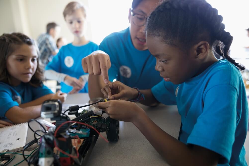 A group of school children working on an electronics project