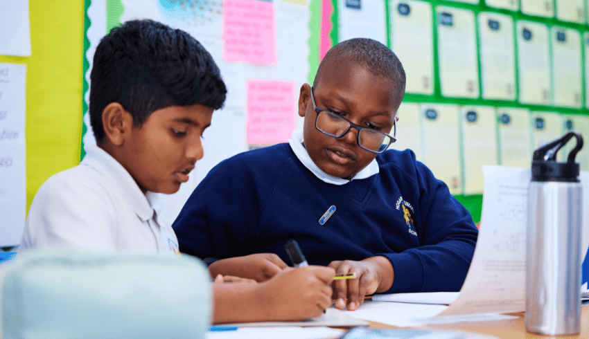 Two Hogarth Primary pupils working at desk