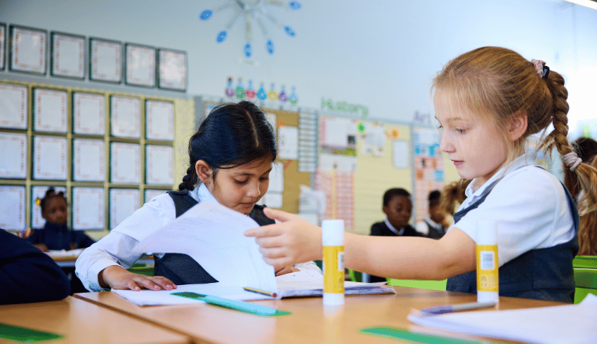 Two Hogarth Primary pupils working at desk