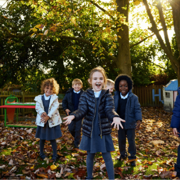 Hogarth Primary schoolchildren standing in outdoor area