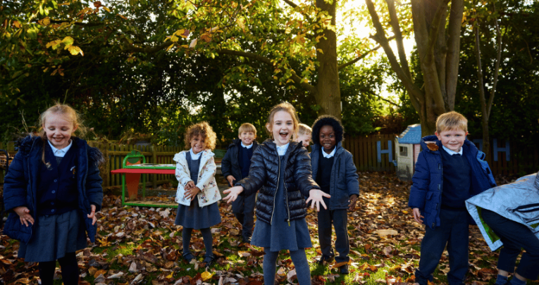 Hogarth Primary schoolchildren standing in outdoor area