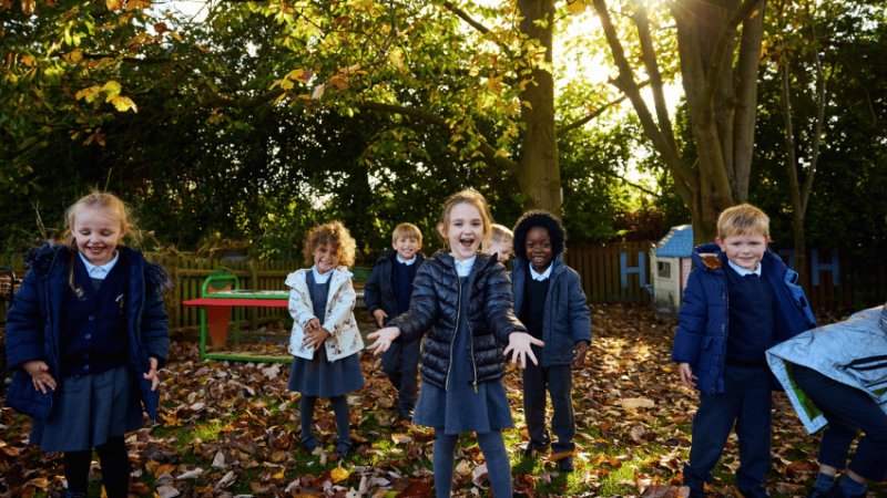 Hogarth Primary schoolchildren standing in outdoor area