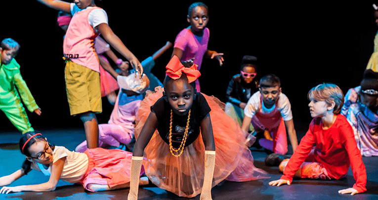 Students performing on a stage