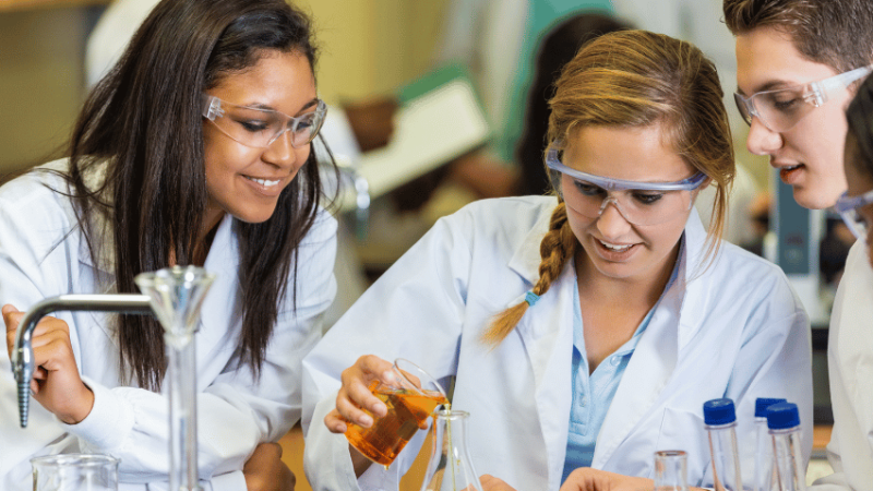 Teenagers doing science practical